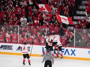 Members of Team Canada celebrate a goal by Adam Fantilli during the second period of IIHF World Junior Hockey Championship semifinal action against USA in Halifax on Wednesday, Jan. 4, 2023.