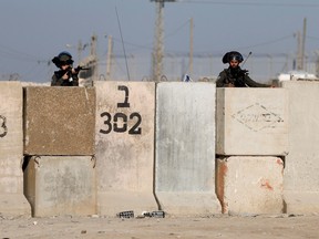 Israeli troop members operate amid clashes with Palestinians, in Al Ram, in the Israeli-occupied West Bank, Jan. 27, 2023.