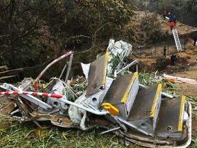 Rescuers inspect the wreckage at the site of a Yeti Airlines plane crash in Pokhara, Nepal, Monday, Jan. 16, 2023.