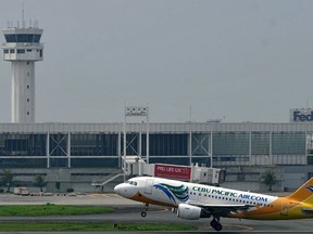 A Cebu Pacific plane takes off at the Ninoy Aquino International Airport (NAIA) in Manila on October 26, 2010.