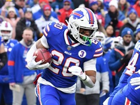Bills running back Nyheim Hines (20) breaks through the Patriots special team to score a touchdown on the opening kickoff at Highmark Stadium in Orchard Park, N.Y., Sunday, Jan. 8, 2023.