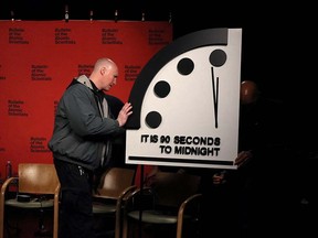 The clock with the Bulletin of the Atomic Scientists is being placed at a TV studio ahead of the announcement of the location of the minute hand on its Doomsday Clock at the National Press Club in Washington January 24, 2023.