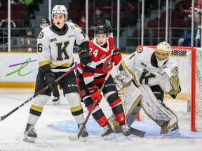 Vinzenz Rohrer of the Ottawa 67’s battles for position with Paul Hughes (left) of the Kingston Frontenacs at the Arena at TD Place on Jan. 11, 2023 in Ottawa. Rohrer later left the game after a nasty fall.