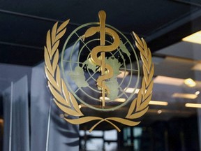 The World Health Organization logo is pictured at the entrance of the WHO building, in Geneva, Switzerland, Dec. 20, 2021.