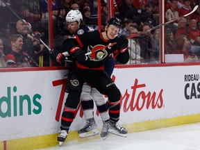 Ottawa Senators left wing Brady Tkachuk (7) checks Columbus Blue Jackets defenseman Marcus Bjork (47) during first period NHL action at the Canadian Tire Centre on Tuesday, Jan. 3, 2023.