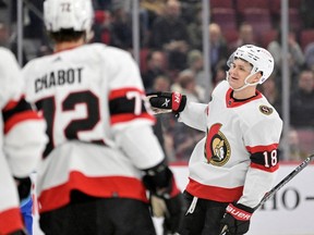 Ottawa Senators forward Tim Stutzle (18) celebrates with teammates after scoring a goal against the Montreal Canadiens during the first period at the Bell Centre. Stutzle had a four-point night for the Senators.