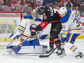 Buffalo Sabres goalie Craig Anderson makes a save on a shot from Ottawa Senators left wing Brady Tkachuk in the first period at the Canadian Tire Centre.