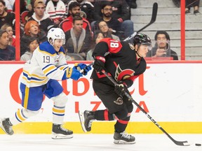 Ottawa Senators centre Tim Stutzle skates with the puck in front of Buffalo Sabres centre Peyton Krebs in the second period at the Canadian Tire Centre.