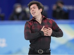 Canada's Keegan Messing reacts at the end of his free program in the men's figure skating competition at the 2022 Winter Olympics in Beijing on Thursday, February 10, 2022.