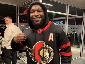 Arizona Cardinals linebacker Jesse Luketa with his Claude Giroux jersey Thursday night in Tempe.