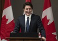 Prime Minister Justin Trudeau smiles as he is welcomed to caucus caucus on Parliament Hill in Ottawa on Friday, Jan. 27, 2023.