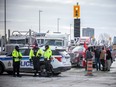Protesters gathered around Parliament Hill and the downtown core for the convoy protest that made their way from various locations across Canada, Sunday January 30, 2022.