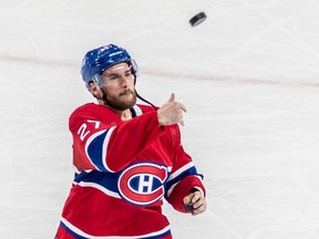 Montreal Canadiens left-wing Jonathan Drouin was tosses a puck to fans after being named the game's first star in a 4-0 win over the Chicago Blackhawks at the Bell Centre in Montreal on Feb. 14, 2023.