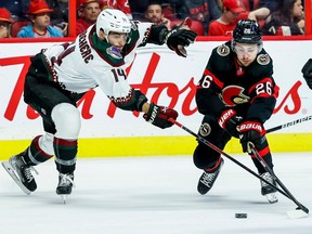 Arizona Coyotes defenceman Shayne Gostisbehere, seen in action against Ottawa Senators defenceman Erik Brannstrom in an October 2022 game, could be an option for the Senators, writes Bruce Garrioch.