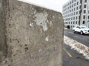  A few splotches of adhesive are all that remains of the plaque that was installed on the northeast corner of the Billings Bridge on Friday, Feb. 10, 2023 