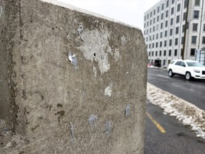A few splotches of adhesive is all that remains of the plaque that was installed on the north east corner of the Billings Bridge on Friday, Feb. 10, 2023