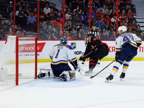 Ottawa Senators centre Shane Pinto (57) scores on St. Louis Blues goaltender Thomas Greiss (1) during first period NHL action at the Canadian Tire Centre on Sunday, Feb. 19, 2023.