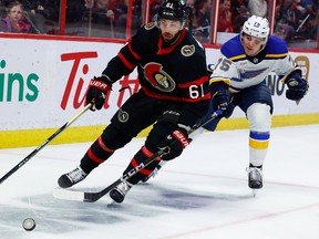 Ottawa Senators centre Derick Brassard (61) and St. Louis Blues defenceman Tyler Tucker (75) during third period NHL action at the Canadian Tire Centre on Sunday, Feb. 19, 2023.