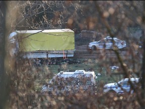 This photograph taken on Feb. 17, 2023, on the outskirts of the village of Lokorsko, some 20 kilometres northeast of Sofia, shows a general view of the discovery of 18 dead migrants in the rear of an abandoned truck.