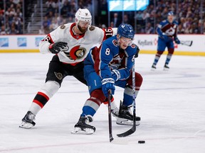 Colorado Avalanche defenceman Cale Makar (8) controls the puck against Ottawa Senators winger Austin Watson on Jan. 14.