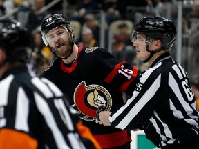 Ottawa Senators left wing Austin Watson (centre) reacts to referee Kelly Sutherland (11) after Watson was assed a roughing penalty against the Pittsburgh Penguins on Jan. 20. Watson returned Monday night against the Calgary Flames after being scratched for three straight games.