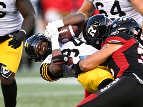 Hamilton Tiger-Cats' Wes Hills (34) playing against what could be his new team.
