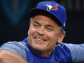 Former John Gibbons manager of the Toronto Blue Jays in 2018, looks on from the dugout as he waits for a game to begin agains the Kansas City Royals at Kauffman Stadium in Kansas City, Missouri. (Photo by Ed Zurga/Getty Images)