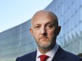 Australian Security Intelligence Organisation, ASIO, Director General Mike Burgess, poses for a portrait ahead of his annual speech at ASIO headquarters in Canberra, Australia, Tuesday, Feb. 21, 2023.