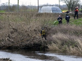 A police diving team works at the River Wyre as they continue their search for missing woman Nicola Bulley, 45, near St Michael's on Wyre, Lancashire, England, Sunday, Feb. 19, 2023.