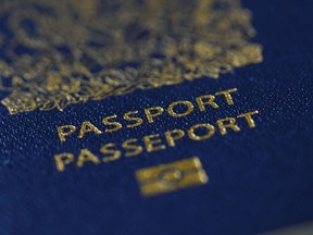 A Canadian passport is pictured in Ottawa, Jan. 17, 2023. As of March 1, measures will come into effect to simplify the process for Iranians visiting, studying or working in Canada to extend their stay and switch between temporary streams.