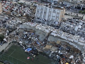 Aerial photo shows the destruction in Hatay's city centre, in southern Turkey, Tuesday, Feb. 7, 2023. Donations are pouring into a Vancouver warehouse for those affected by Monday's devastating earthquake in Turkey.