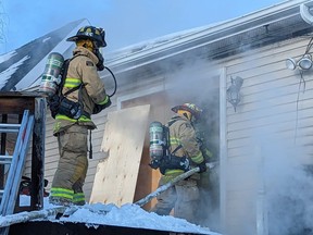 Ottawa firefighters battle a blaze at an abandoned building on St. Paul Street in Vanier on Sunday, Feb. 26, 2023.