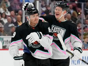 Feb 4, 2023; Sunrise, Florida, USA; Atlantic Division forward Brady Tkachuk (71) of the Ottawa Senators congratulates Atlantic Division forward Matthew Tkachuk (19) of the Florida Panthers during the second period of a semifinal game during the 2023 NHL All-Star Game at FLA Live Arena.