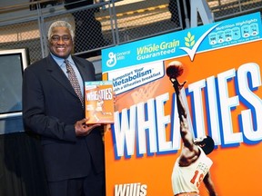 NBA legend Willis Reed poses with his Wheaties box during the unveiling of the special-edition Wheaties box at the NBA Store on February 4, 2009 in New York City.