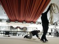 Crew members ready the white carpet for Sunday's 95th Academy Awards, Wednesday, March 8, 2023, outside the Dolby Theatre in Los Angeles.