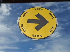 A sign points the way to a polling station for voting in the 2021 Canadian election.