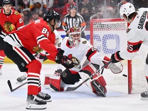 Ottawa Senators goaltender Mads Sogaard makes a save on a shot from Chicago Blackhawks forward Andreas Athanasiou in the second period at United Center. USA TODAY SPORTS