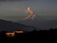 A plume of steam and gas billows from the Cotopaxi volcano as seen from Quito on Thursday, March 16, 2023.