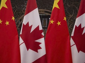 Canadian and Chinese flags taken prior to a meeting with Prime Minister Justin Trudeau and China's President Xi Jinping at the Diaoyutai State Guesthouse in Beijing. on Dec. 5, 2017.