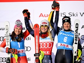 Mikaela Shiffrin of the U.S. celebrates winning the women's slalom with second placed Swizterland's Wendy Holdener and third placed Sweden's Anna Swenn Larsson at the FIS Alpine Ski World Cup in Are, Sweden, on March 11, 2023.