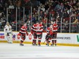 Brady Stonehouse, second from right, celebrates with teammates after scoring a second-period goal for the 67's against the Colts on Saturday afternoon.