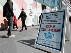 A sign for a COVID-19 testing tent sits along a Manhattan street on March 9, 2023 in New York City.