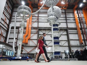 Deputy Prime Minister and Minister of Finance Chrystia Freeland and B.C. Premier David Eby arrive for a news conference after touring Powertech Labs, in Surrey, B.C., on Thursday, March 30, 2023.