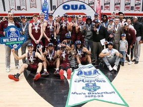 The University of Ottawa Gee-Gees celebrate their Wilson Cup men's basketball championship over the Carleton Ravens Saturday night at the Ravens Nest.
VALERIE WUTTI PHOTO