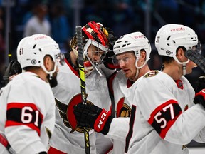 Ottawa Senators goaltender Mads Sogaard (40) and center Patrick Brown (38) celebrate after defeating the Seattle Kraken at Climate Pledge Arena. Ottawa defeated Seattle 5-4.