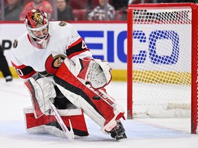 Senators goaltender Mads Sogaard (40) makes a save on a shot by the Blackhawks in Monday's game at Chicago.