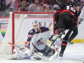 Senators forward Tim Stutzle (18) scores against Blue Jackets goalie Elvis Merzlikins in the first period of Saturday's game.