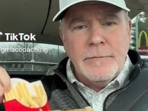 Kevin Maginnis, holding McDonalds fries, who is on a 100-day McDonalds-only diet.