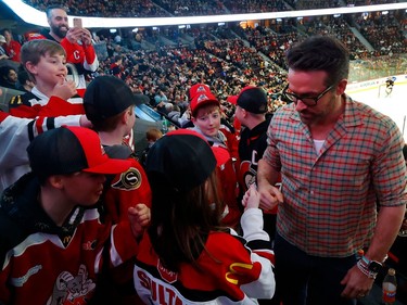 Actor Ryan Reynolds attending the Ottawa Senators game at the Canadian Tire Centre in Ottawa Thursday night. Ryan climbed over the wall of the box next to his to greet some young Senatror fans.