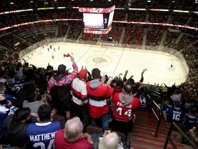 Ottawa Senators fans cheer during a game.